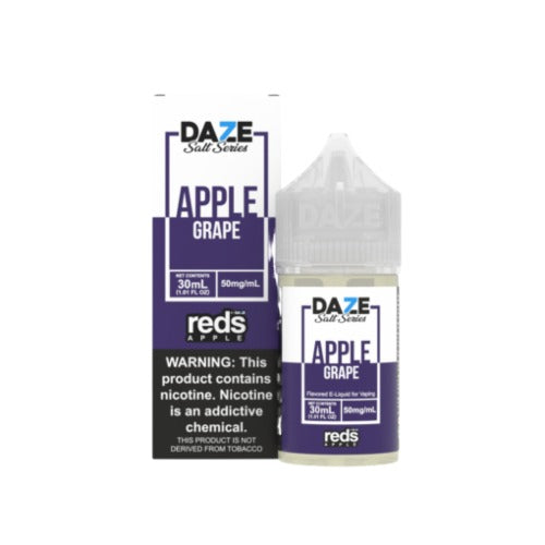 A 30 mL bottle of Reds Apple by 7 Daze brand Salt Series apple grape-flavored ejuice. The packaging contains the warning, 